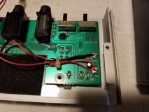 Closer image of 5.5mm x 2.1mm DC power jack connected to the battery leads on the circuit board