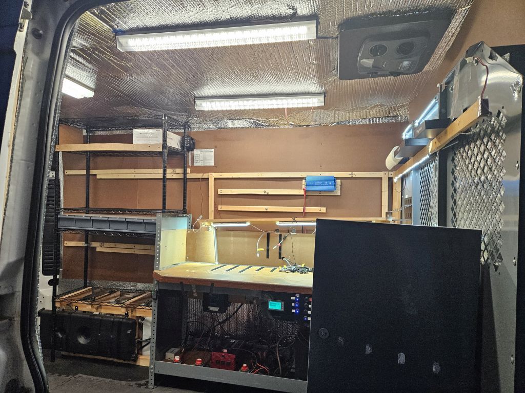 2016 Promaster 1500 136WB Cargo Bay Side Door Open showing lights in early morning 02